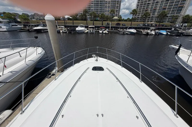Slide: The Image of Bow view of 2007 Sea Ray 44 Sundancer docked at marina. - 11
