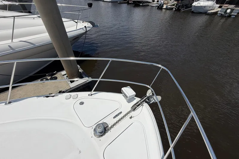 Slide: The Image of Bow of 2007 Sea Ray 44 Sundancer yacht docked at marina. - 14
