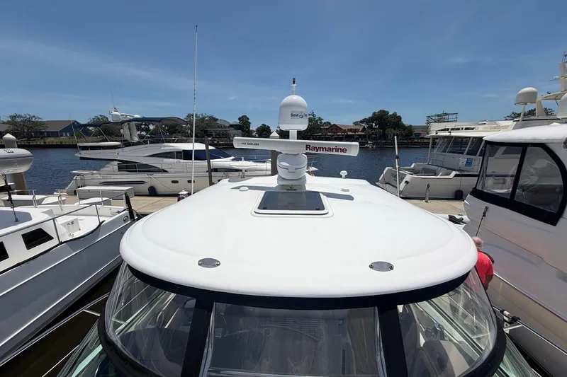 Slide: The Image of 2007 Sea Ray 44 Sundancer yacht docked at marina with Raymarine equipment. - 15
