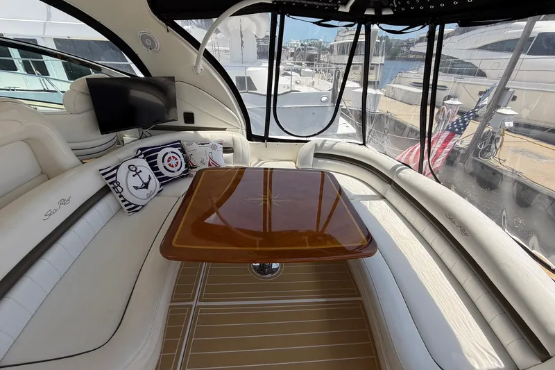 Slide: The Image of Luxurious interior of 2007 Sea Ray 44 Sundancer yacht with elegant seating and table. - 17