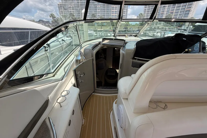 Slide: The Image of 2007 Sea Ray 44 Sundancer cockpit with luxurious seating and modern design. - 18