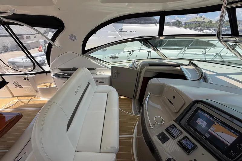 Slide: The Image of Interior of 2007 Sea Ray 44 Sundancer yacht with modern dashboard and seating. - 22