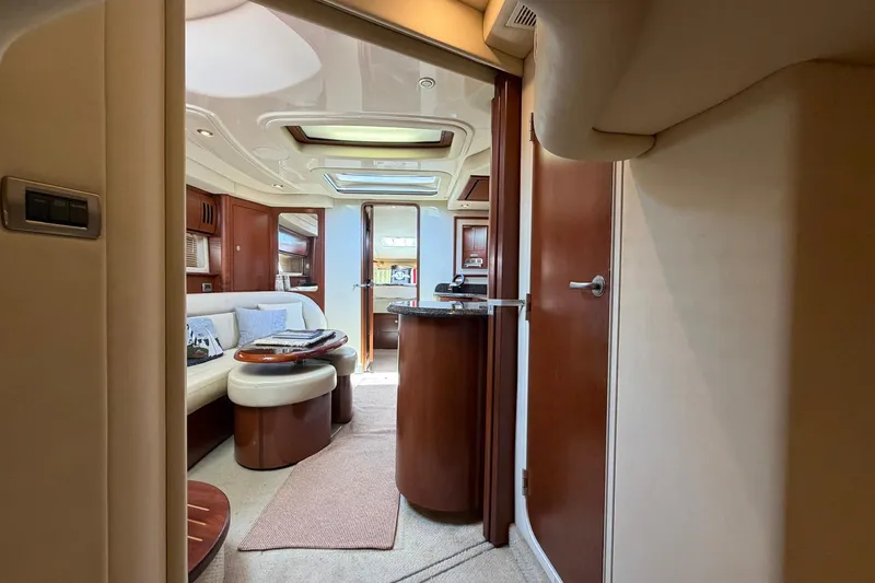 Slide: The Image of Luxurious interior of 2007 Sea Ray 44 Sundancer yacht with elegant seating and wood finishes. - 25