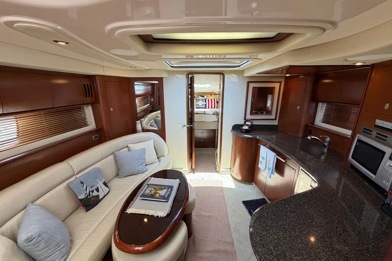 Slide: The Image of Luxurious interior of a 2007 Sea Ray 44 Sundancer yacht with elegant seating and modern kitchen. - 26