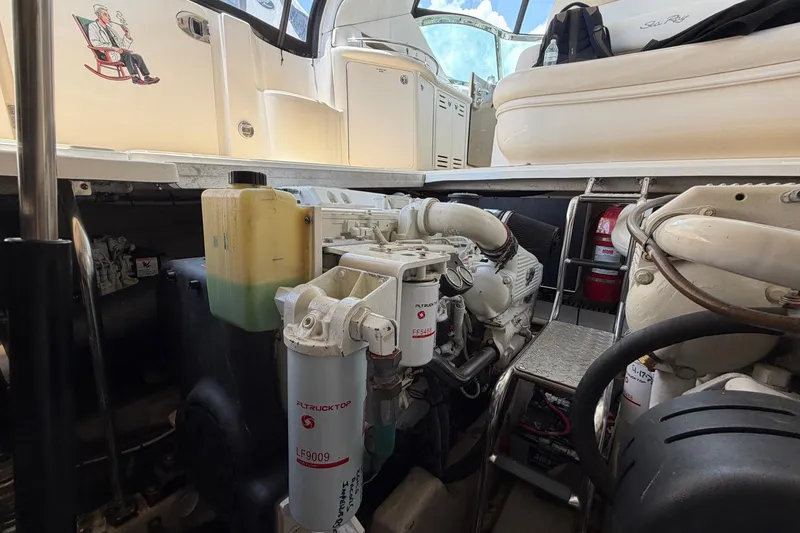 Slide: The Image of Engine compartment of a 2007 Sea Ray 44 Sundancer yacht, showcasing mechanical components. - 36