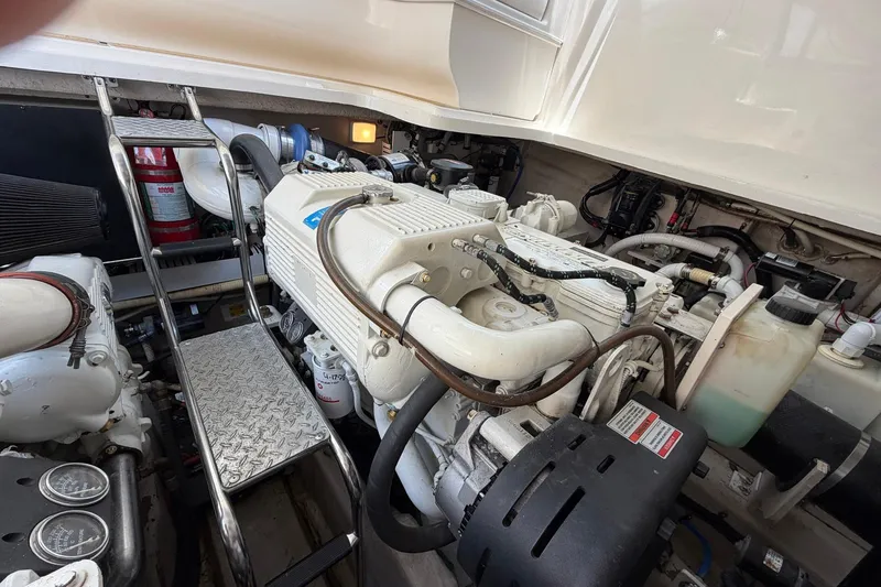Slide: The Image of Engine room of a 2007 Sea Ray 44 Sundancer yacht, showcasing mechanical components. - 37
