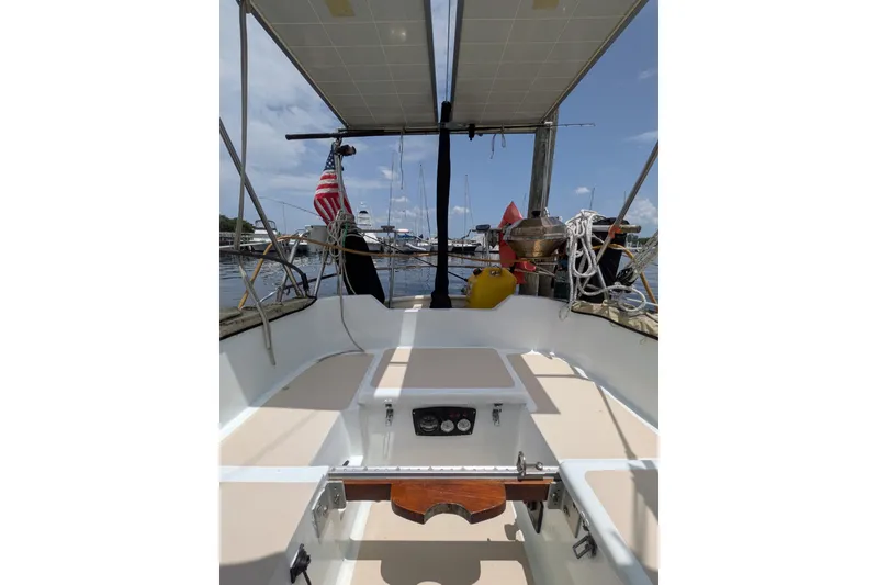 Slide: The Image of Cockpit view of 1978 Hallberg-Rassy Monsun 31 sailboat with solar panels and American flag. - 37