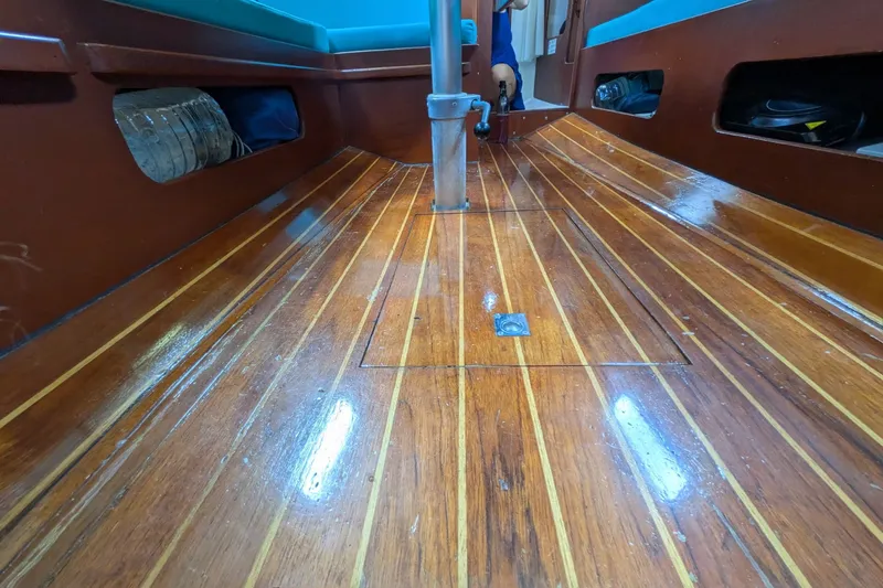 Slide: The Image of Interior view of 1978 Hallberg-Rassy Monsun 31 sailboat with polished wooden flooring. - 18