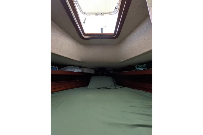 Slide: The Image of Cozy cabin interior of 1978 Hallberg-Rassy Monsun 31 sailboat with skylight. - 44