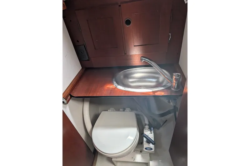 Slide: The Image of 1978 Hallberg-Rassy Monsun 31 yacht bathroom with sink and toilet. - 48