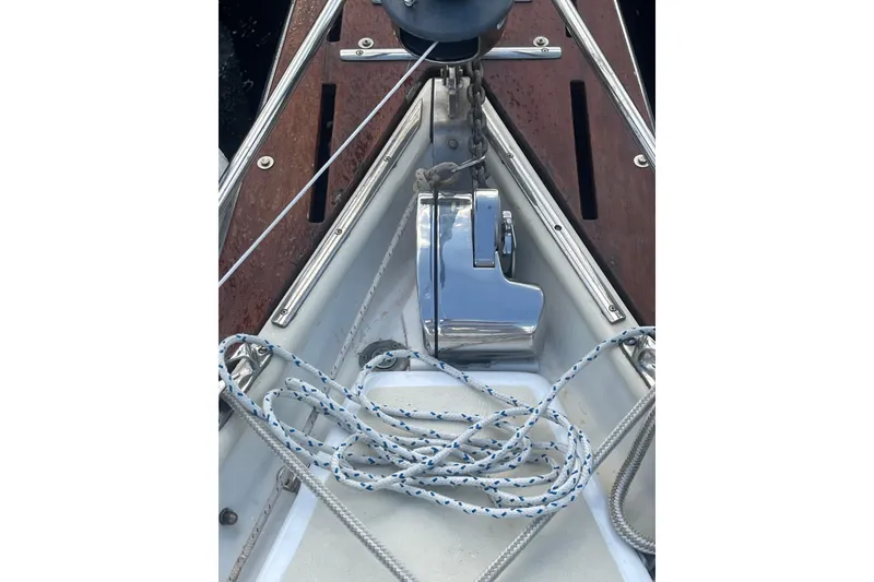 Slide: The Image of Deck of 1987 Hallberg-Rassy Monsun 31 sailboat with anchor chain and ropes. - 5