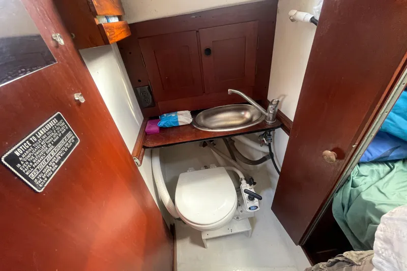 Slide: The Image of Interior of 1987 Hallberg-Rassy Monsun 31 sailboat bathroom with sink and toilet. - 18