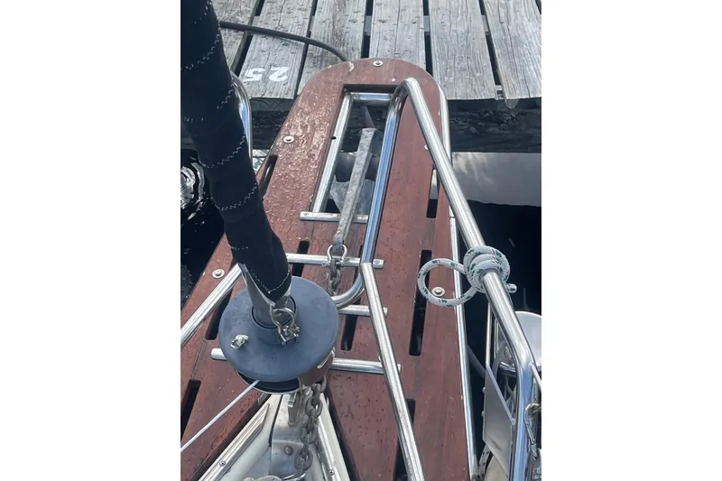 Slide: The Image of Hallberg-Rassy Monsun 31 sailboat bow detail, 1987 model, docked with visible deck fittings. - 6