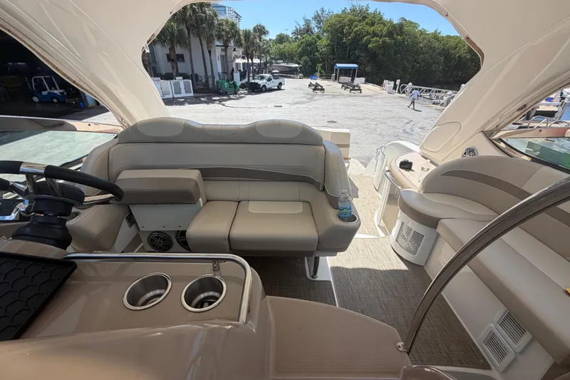 Slide: The Image of Interior of a 2016 Performance Cruiser Formula 40 yacht, featuring luxurious seating and helm. - 16