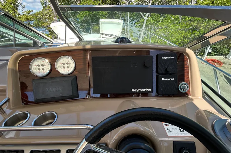 Slide: The Image of 2016 Performance Cruiser Formula 40 dashboard with Raymarine navigation system and gauges. - 19