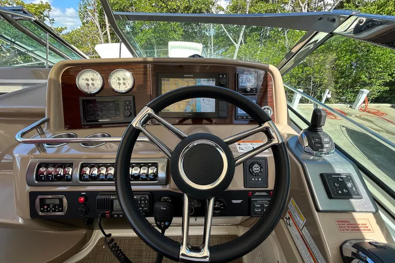 Slide: The Image of The cockpit of a 2016 Performance Cruiser Formula 40 with modern instruments and controls. - 20