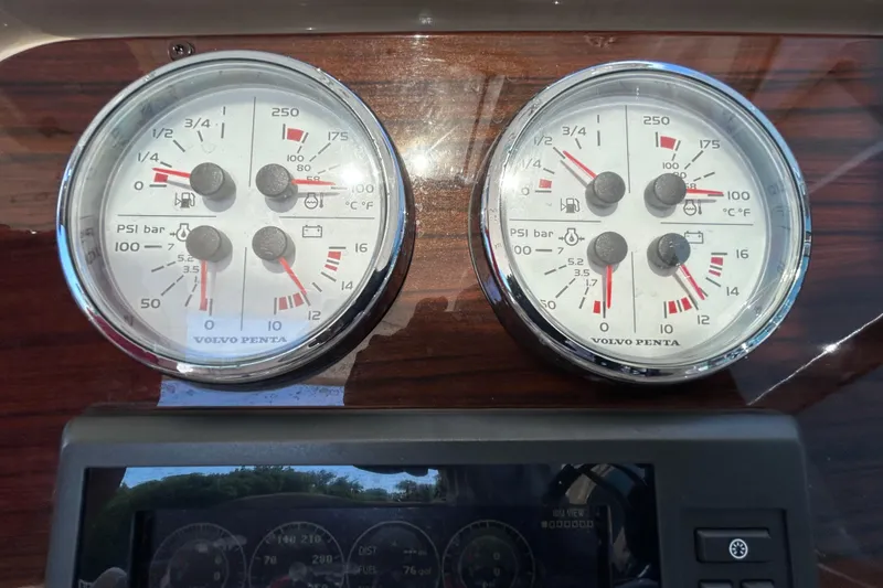 Slide: The Image of Close-up of Volvo Penta gauges on a 2016 Performance Cruiser Formula 40 dashboard. - 22