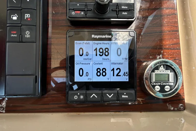 Slide: The Image of Control panel of a 2016 Performance Cruiser Formula 40 with Raymarine display and Lewmar chain counter. - 26