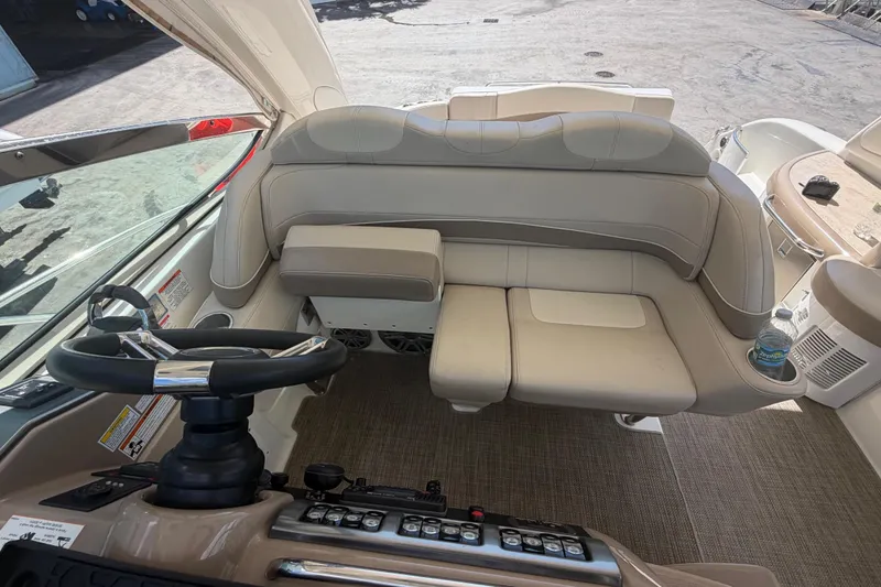 Slide: The Image of Interior of a 2016 Performance Cruiser Formula 40 boat, featuring helm and seating area. - 34
