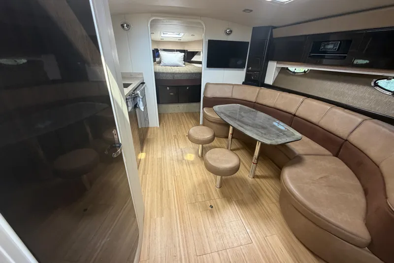 Slide: The Image of Interior of 2016 Performance Cruiser Formula 40, featuring a cozy seating area and modern amenities. - 40