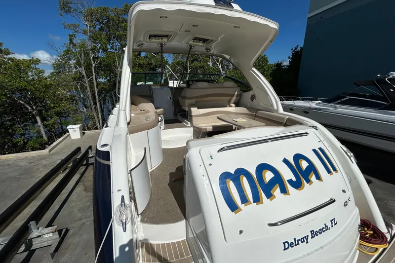 Slide: The Image of 2016 Performance Cruiser Formula 40 boat docked, featuring spacious seating and "MAJA II" name. - 42