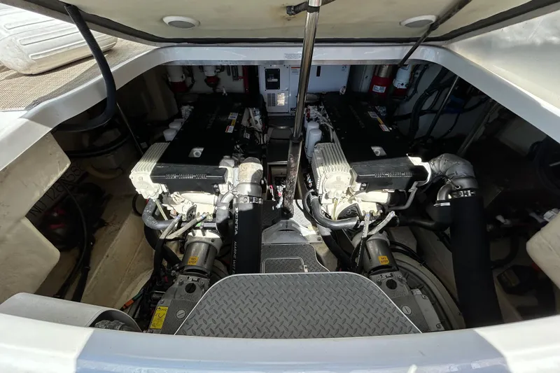 Slide: The Image of Engine compartment of a 2016 Performance Cruiser Formula 40, showcasing dual engines and mechanical components. - 43