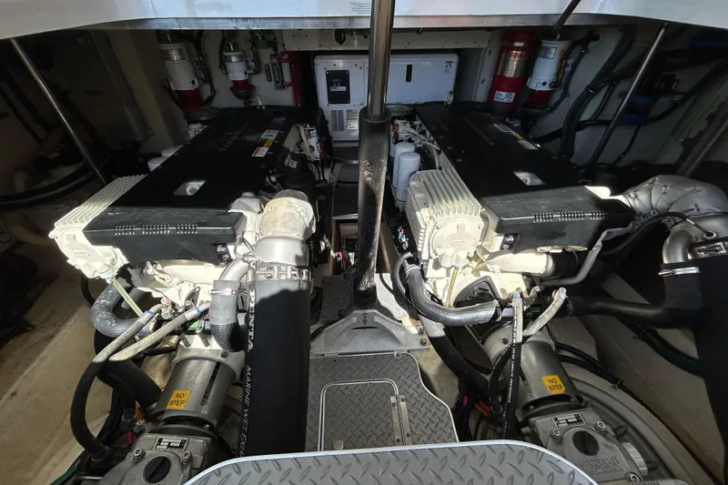 Slide: The Image of Engine room of a 2016 Performance Cruiser Formula 40 with dual engines and mechanical components. - 44