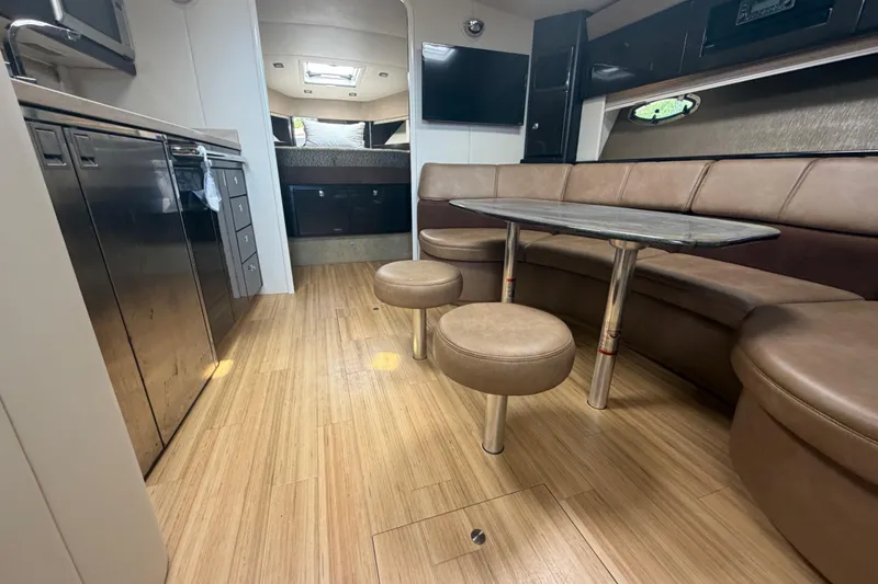 Slide: The Image of Interior of a 2016 Performance Cruiser Formula 40, featuring a modern kitchen and cozy seating area. - 45
