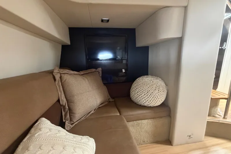 Slide: The Image of Interior of 2016 Performance Cruiser Formula 40 with cozy seating and cushions. - 49