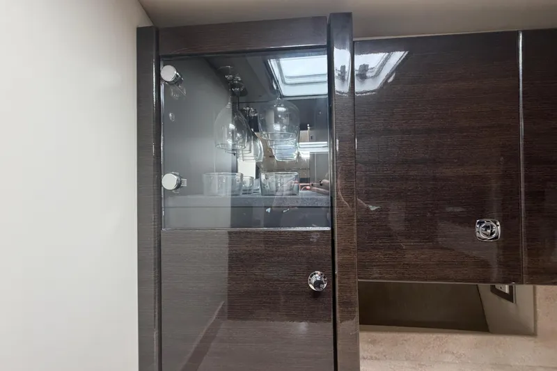 Slide: The Image of Luxurious interior of 2016 Performance Cruiser Formula 40 with glass cabinet and modern design. - 54