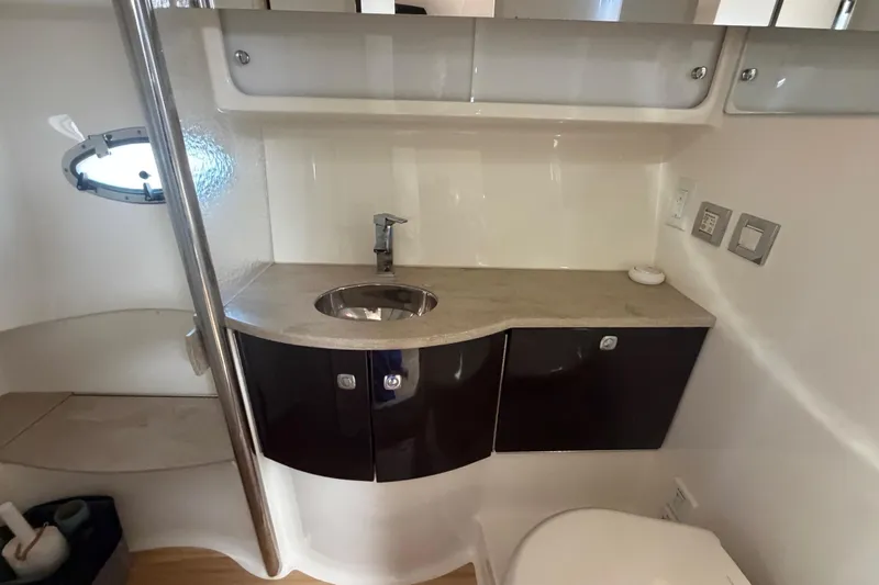 Slide: The Image of Modern bathroom interior of 2016 Formula 40 Performance Cruiser yacht, featuring sleek sink and cabinetry. - 58