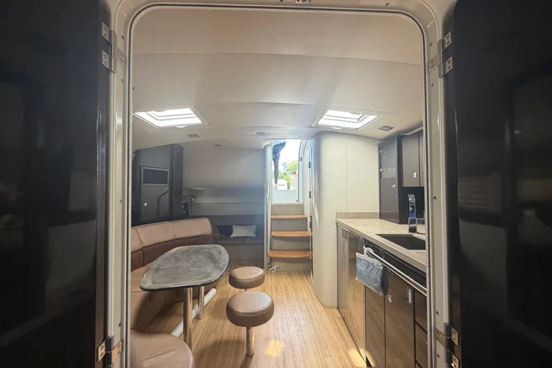 Slide: The Image of Interior of 2016 Performance Cruiser Formula 40, featuring modern kitchen and seating area. - 63