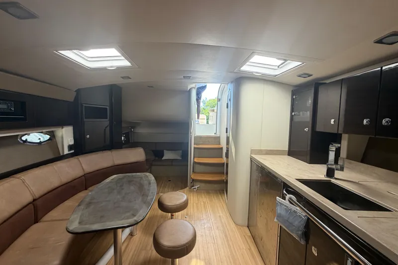Slide: The Image of Interior of 2016 Performance Cruiser Formula 40, featuring modern kitchen and seating area. - 64