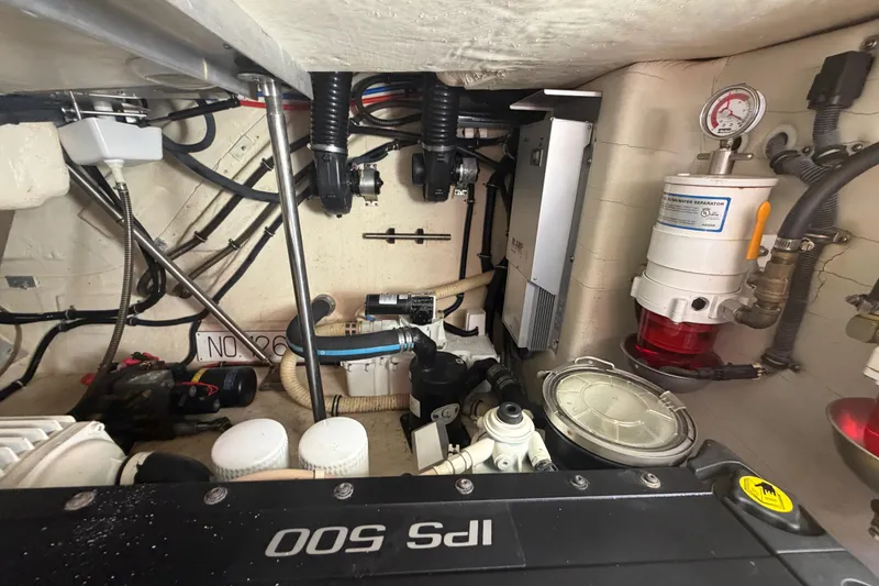 Slide: The Image of Engine room of a 2016 Performance Cruiser Formula 40, showcasing mechanical components and systems. - 69