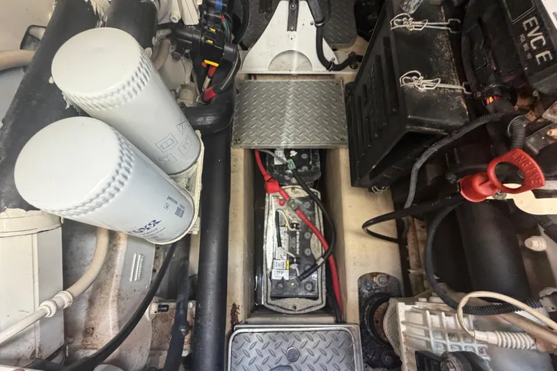 Slide: The Image of Engine compartment of a 2016 Performance Cruiser Formula 40 with visible battery and filters. - 78