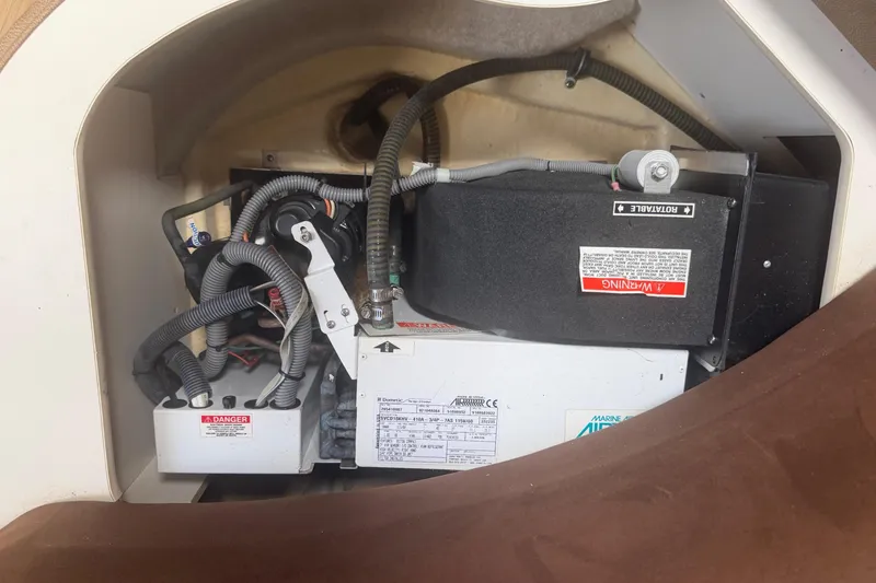 Slide: The Image of Engine compartment of a 2016 Performance Cruiser Formula 40 boat, showcasing mechanical components. - 79