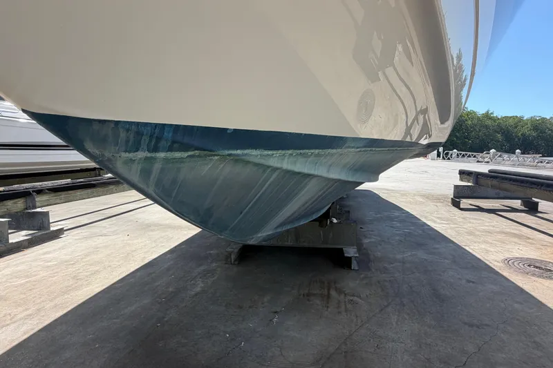 Slide: The Image of 2016 Performance Cruiser Formula 40 boat hull on dry dock, showcasing sleek design. - 87
