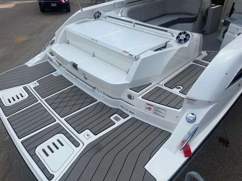 Slide: The Image of The image shows the stern of a 2025 Sea Ray SLX 350 with gray and white accents. - 7