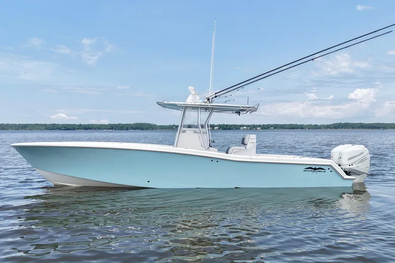 The Image of 2008 Invincible 33 Open Fisherman boat on calm water, clear sky background. - 0