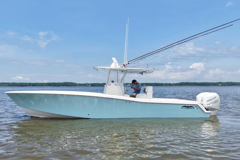 Slide: The Image of 2008 Invincible 33 Open Fisherman boat on calm water, clear sky background. - 1