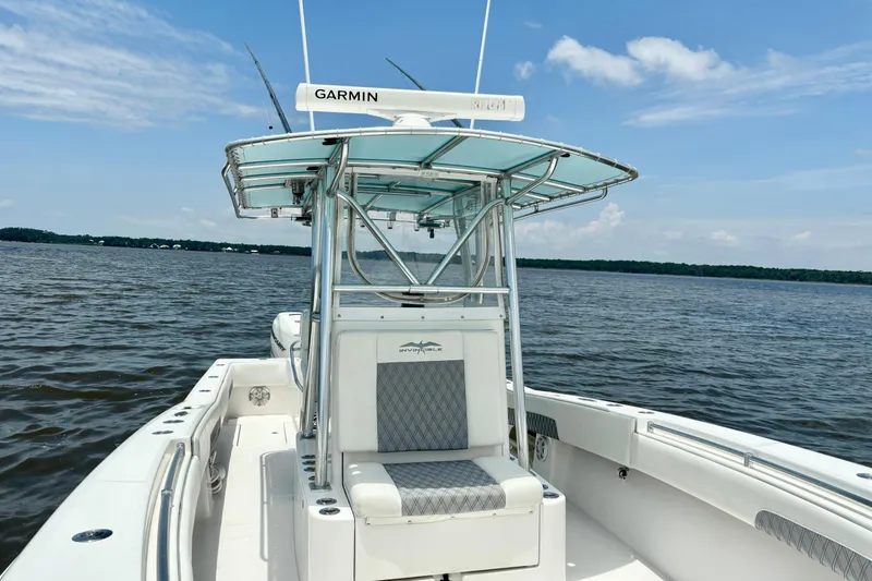 Slide: The Image of 2008 Invincible 33 Open Fisherman boat on calm waters under a clear blue sky. - 20