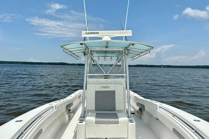 Slide: The Image of 2008 Invincible 33 Open Fisherman boat on calm waters under a clear blue sky. - 21