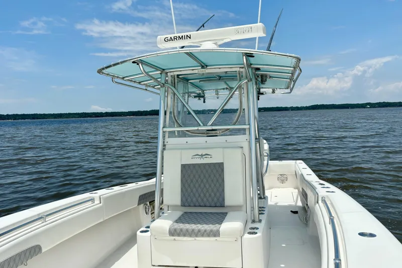 Slide: The Image of 2008 Invincible 33 Open Fisherman boat on calm waters under a clear blue sky. - 22