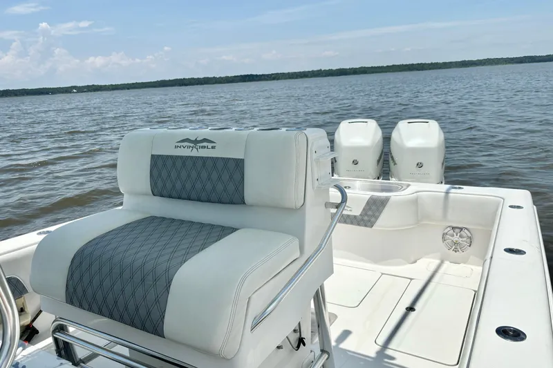 Slide: The Image of 2008 Invincible 33 Open Fisherman boat with dual engines on a calm lake. - 31