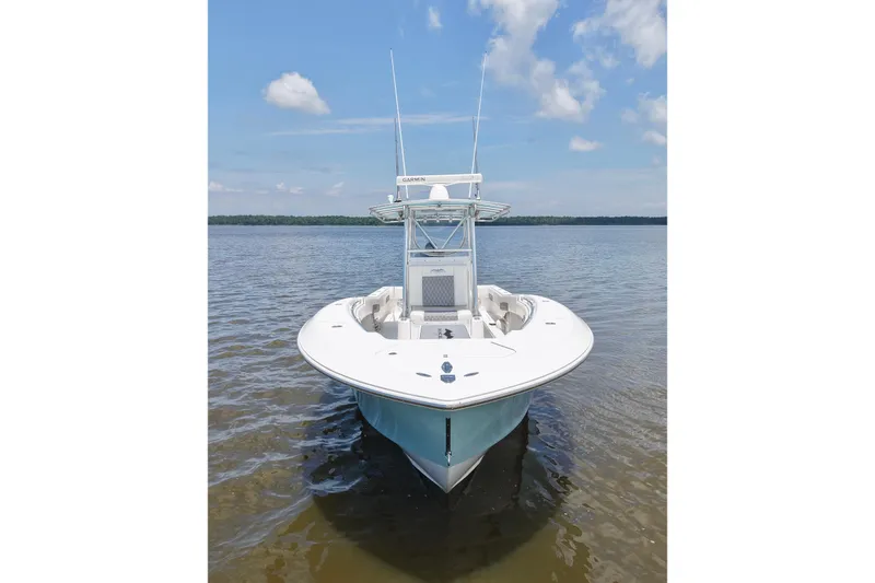 Slide: The Image of 2008 Invincible 33 Open Fisherman boat on calm water under blue sky. - 6