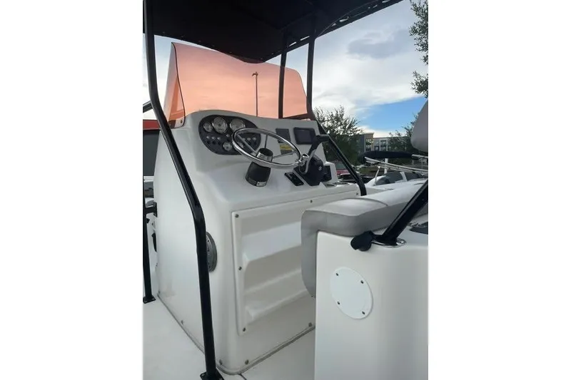 Slide: The Image of 2024 Key Largo 2100 CCW boat console with steering wheel and gauges. - 3