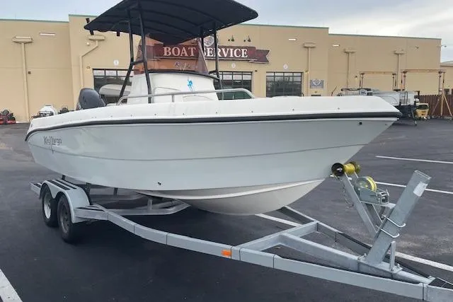 The Image of 2024 Key Largo 2100 CCW boat on trailer at service center. - 0