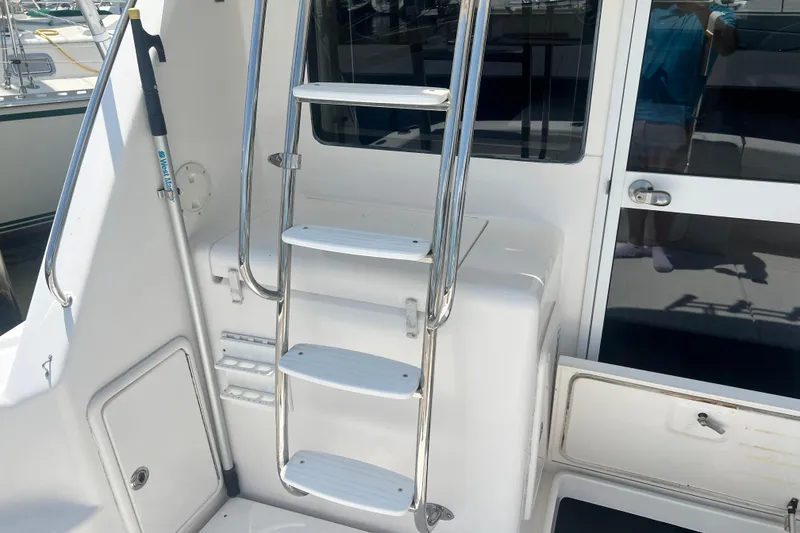 Slide: The Image of Stainless steel ladder on 2007 Riviera 33 Flybridge yacht, leading to upper deck. - 37