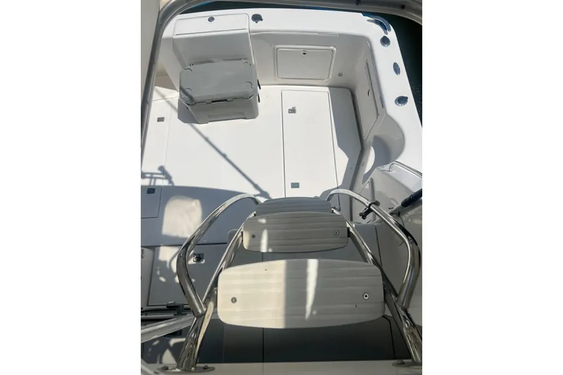 Slide: The Image of 2007 Riviera 33 Flybridge boat deck with seating and stainless steel ladder. - 50