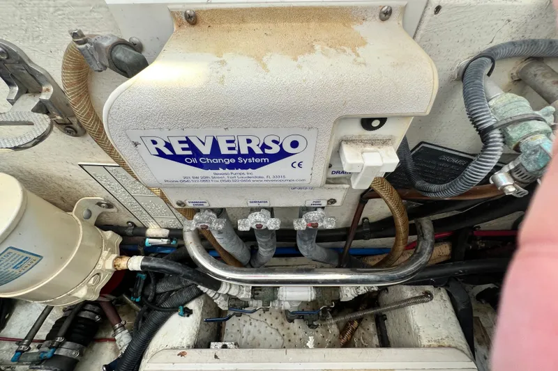 Slide: The Image of Reverso oil change system in 2007 Riviera 33 Flybridge engine compartment. - 55